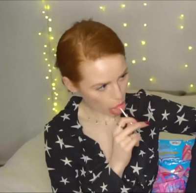 Madi eating a lollipop
