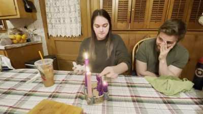 My Sister Pinching a Candle
