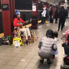He sings pretty woman with his dolls. 53rd &3rd ave street M/E train station