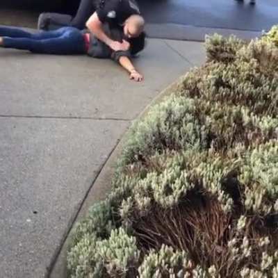 A cop chokes a woman to stop her from telling her husband's information