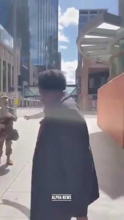 A would-be rioter confronts the National Guard