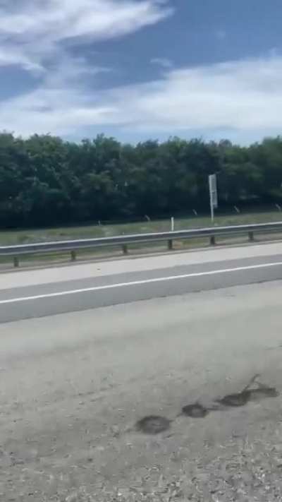 Trucker carries excess load on highway