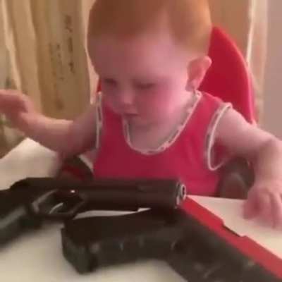Giving a small infant firearms