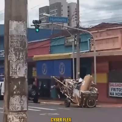 A guy walking with junk