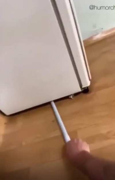 Cleaning under the fridge