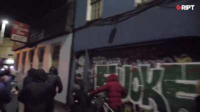 Far-right protestors in Ireland hunt migrants. One of them shouts 